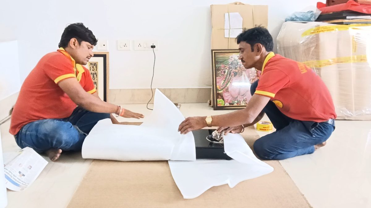 Professional packing of glass top gas stove with foam sheet, Corrugated sheets and lamination. by National Packers and Movers, best packers and movers, packers and movers near me, safe packing